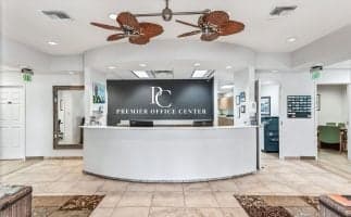 Front desk of the premier coffee center, featuring a sleek design and a barista ready to assist customers.