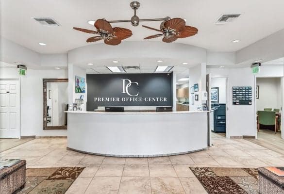 Front desk of the premier coffee center, featuring a sleek design and a barista ready to assist customers.